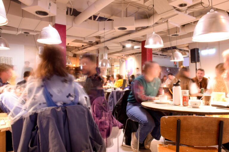 A crowded, noisy restaurant dining room