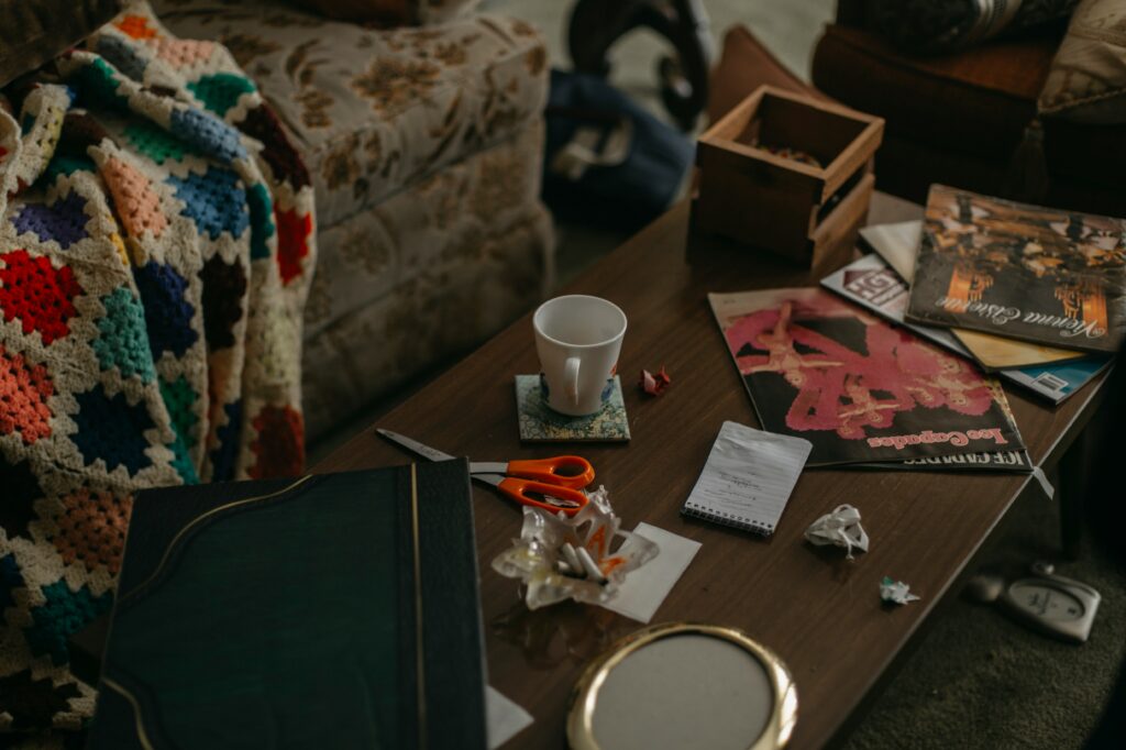 Old printed photographs and keepsakes scattered across a table