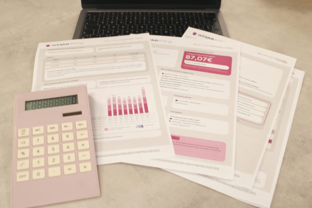 A calculator and financial statements spread on a table